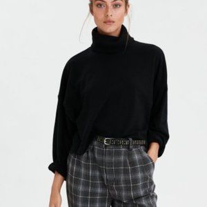 Cropped raw edge turtleneck